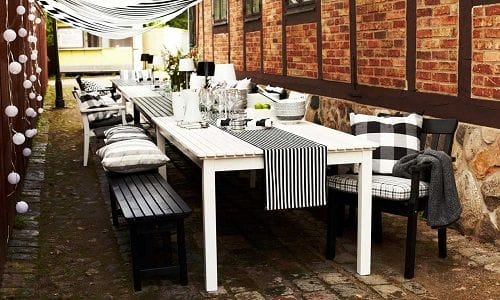 mesa exterior con camino de mesa