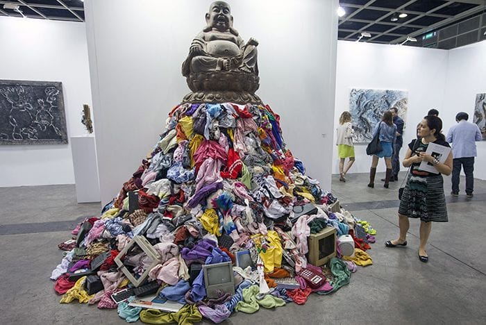 epa04205014 A woman looks at an artwork by Italian artist Michelangelo Pistoletto entitled 'Rem(a)inders' at Art Basel 2014, Hong Kong, China, 14 May 2014. Art Basel is in its second year in Hong Kong and features 245 galleries from 39 countries. Hong Kong is the third largest art market in the world by auction revenue. The show runs from 15 to 18 May. EPA/ALEX HOFFORD