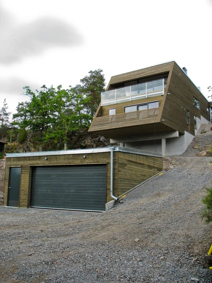 vivienda garaje ventanas inclinacion fachada tierra hundida