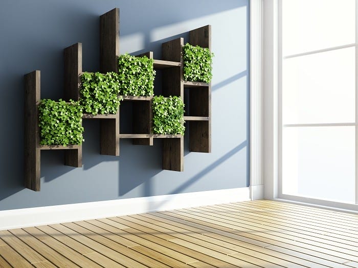 Interio de hogar con jardines verticales artificiales enmarcados en la pared