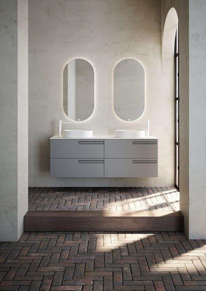 Lavabo gris con dos espejos ovalados