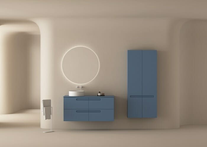 Diseño de un lavabo color azul a juego con el armario para baño