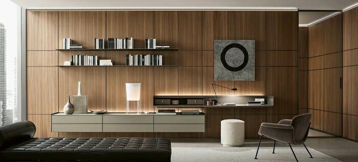 Salón con un escritorio de diseño con iluminación led y sillón