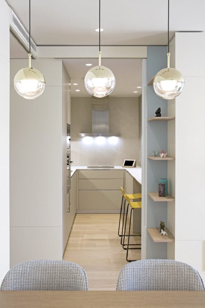 Detalle luminaria colgante salón y apliques comedor en diseños de CírculoCuadrado